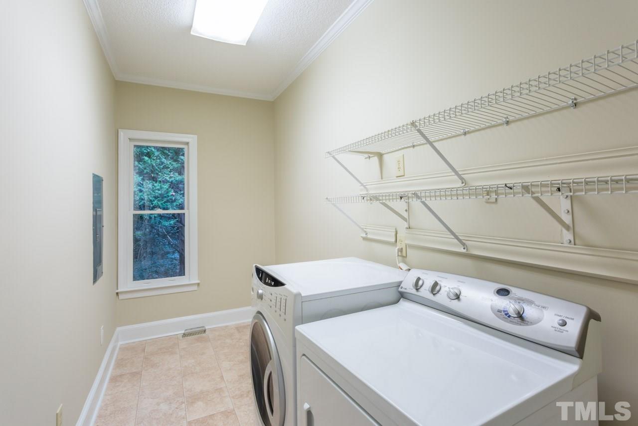2909 Patrie Place Raleigh, NC 27613 - Photo 20 of 25 a utility room with dryer and washer