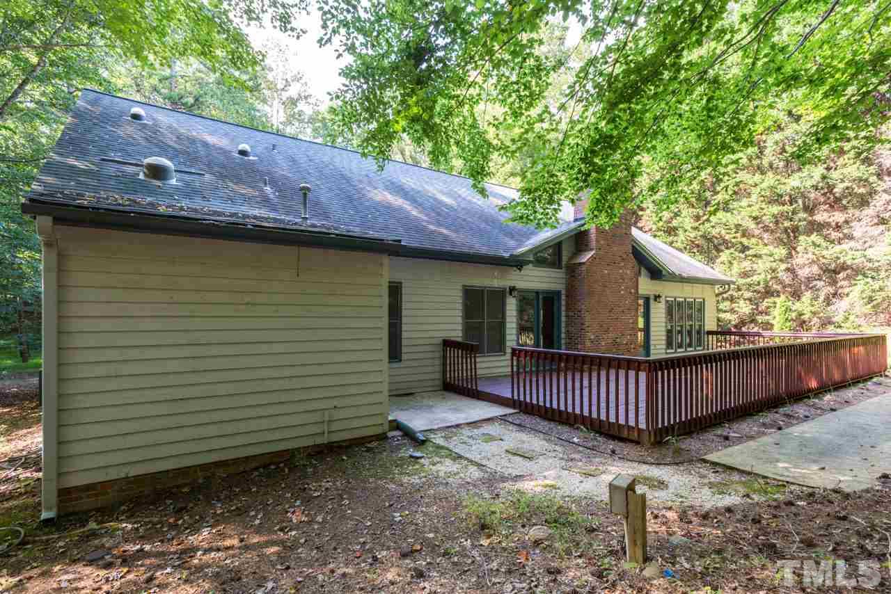 2909 Patrie Place Raleigh, NC 27613 - Photo 23 of 25 a view of a house with a yard and deck