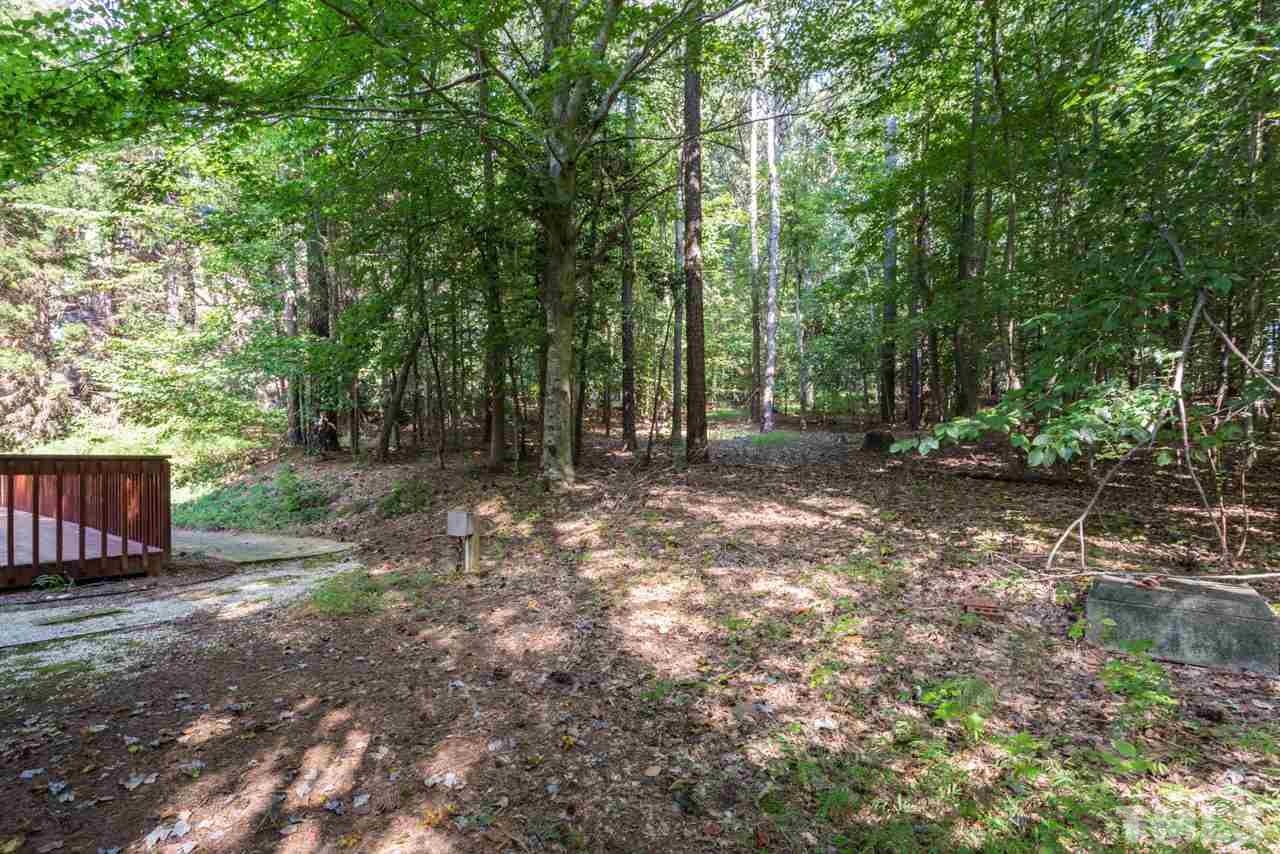 2909 Patrie Place Raleigh, NC 27613 - Photo 25 of 25 a view of backyard with green space and trees