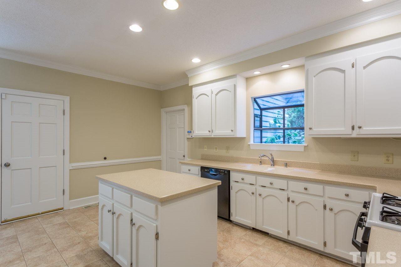 2909 Patrie Place Raleigh, NC 27613 - Photo 9 of 25 a utility room with cabinets washer and dryer