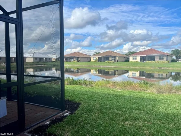 a view of a lake with a big yard