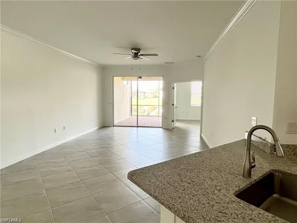 a view of a kitchen with a sink and a window