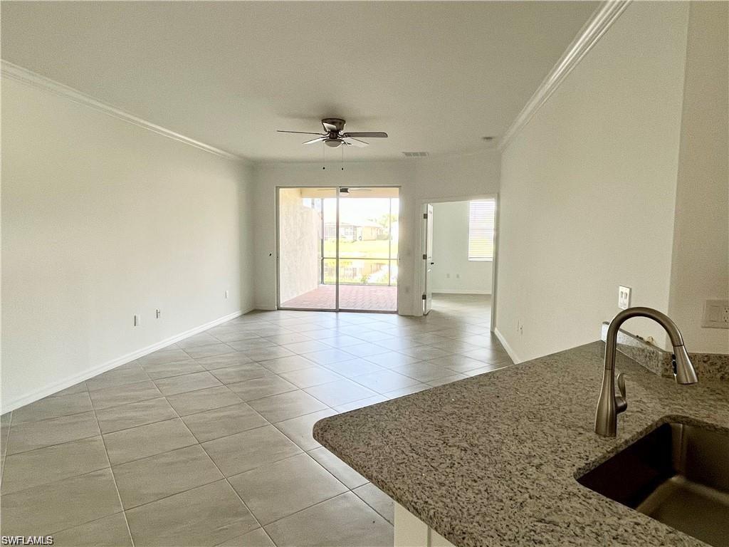 2057 Tamarron Lane Naples, FL 34120 - Photo 4 of 27 a view of a kitchen with a sink and a window