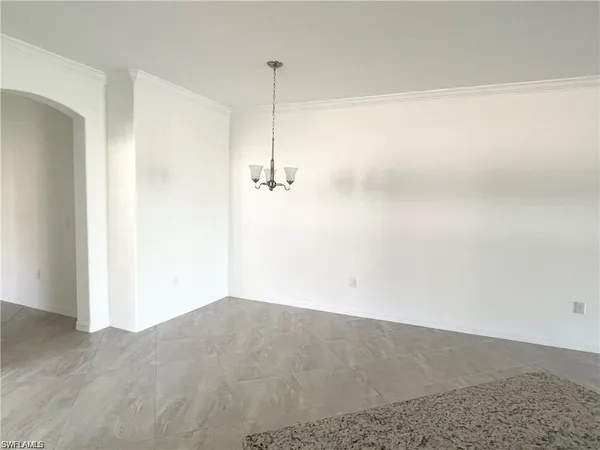 a view of empty room with floor to ceiling window