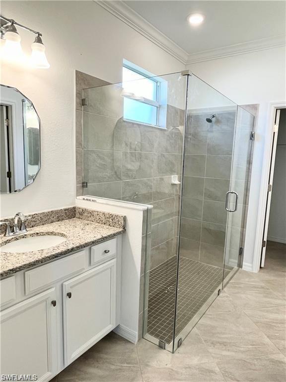 2057 Tamarron Lane Naples, FL 34120 - Photo 7 of 27 a bathroom with a granite countertop sink mirror and double