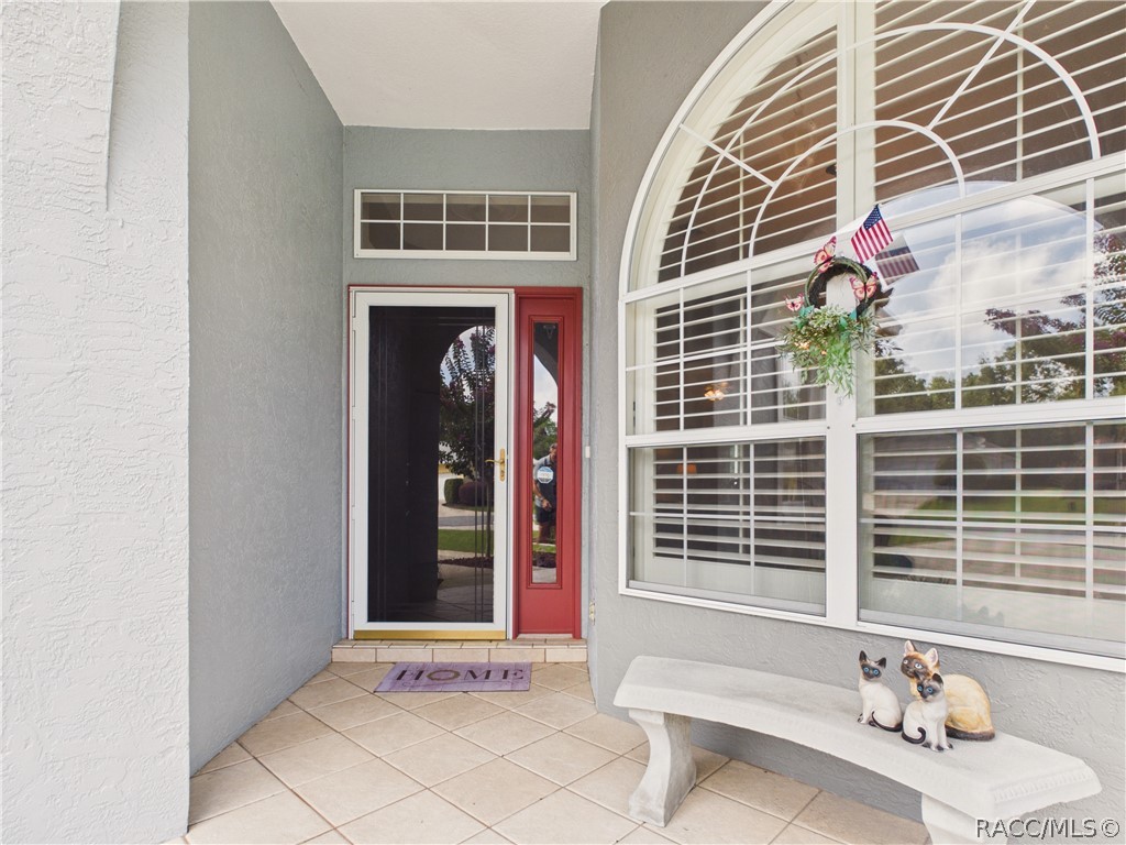 42 Byrsonima Loop Homosassa, FL 34446 - Photo 5 of 50 COVERED FRONT SINGLE DOOR ENTRY