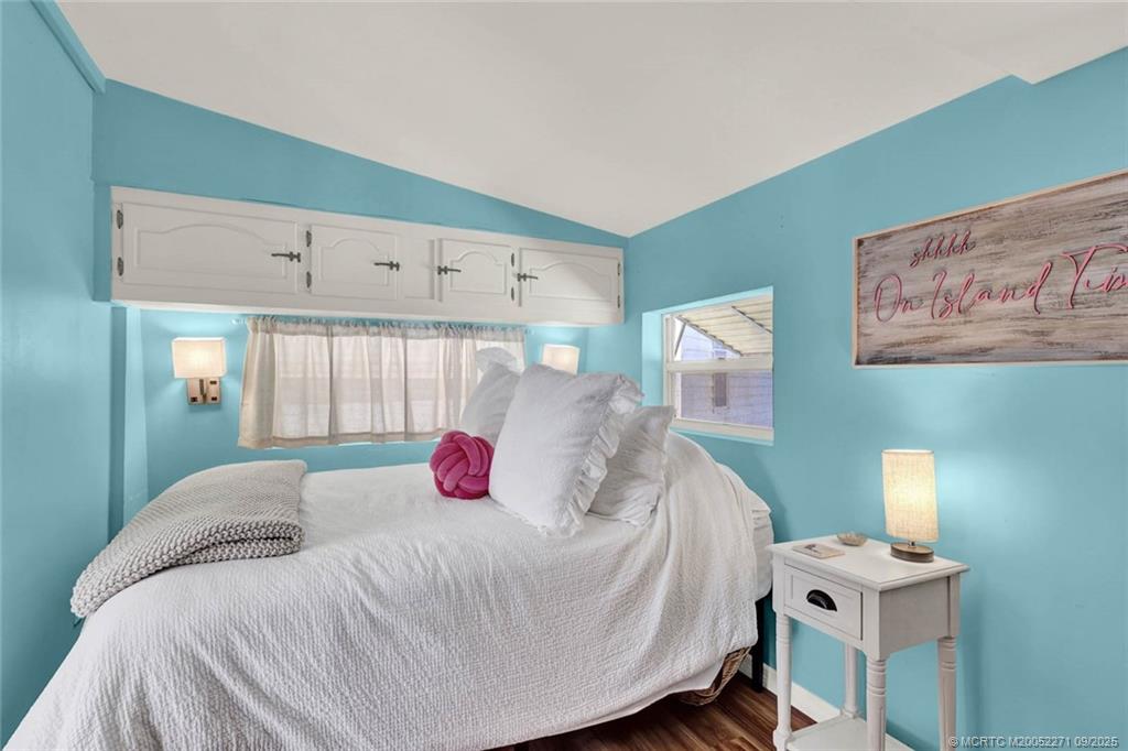 10701 South Ocean Drive, Unit 713 Jensen Beach, FL 34957 - Photo 13 of 39 a bedroom with a bed and a window