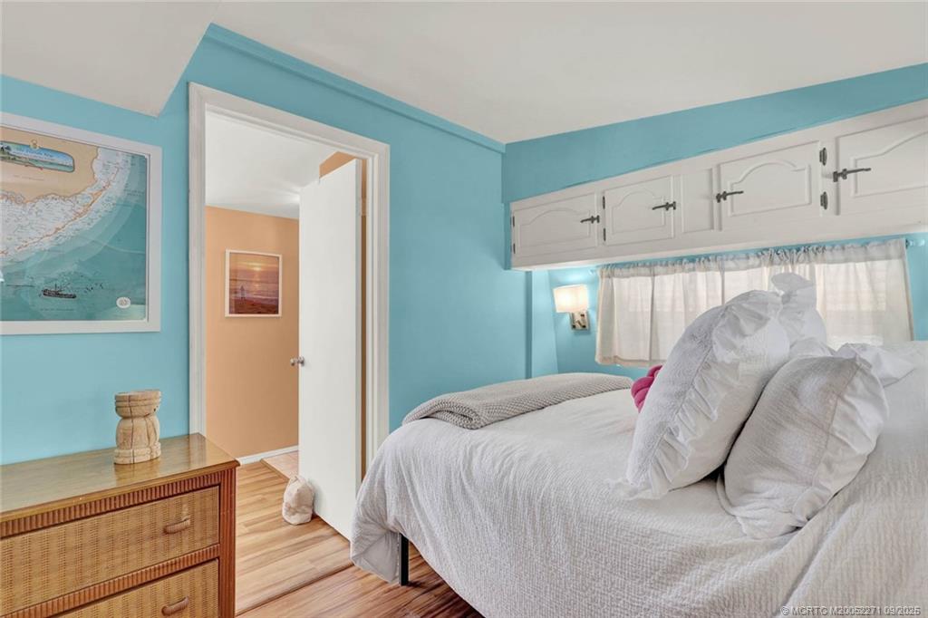 10701 South Ocean Drive, Unit 713 Jensen Beach, FL 34957 - Photo 14 of 39 a bedroom with a bed and window