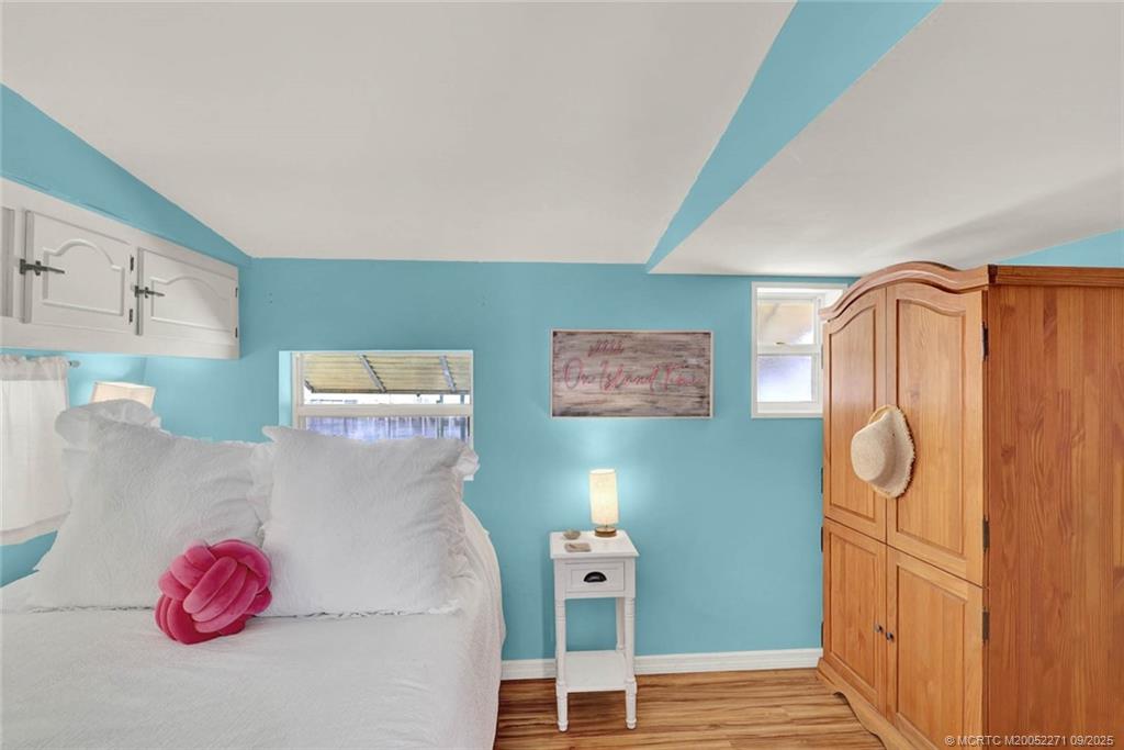 10701 South Ocean Drive, Unit 713 Jensen Beach, FL 34957 - Photo 15 of 39 a view of a room with rack and wooden floor