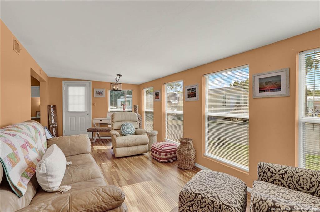10701 South Ocean Drive, Unit 713 Jensen Beach, FL 34957 - Photo 3 of 39 a spacious bedroom with a bed and glass window