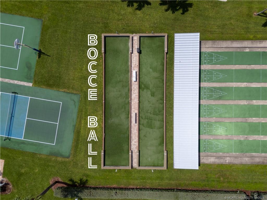 10701 South Ocean Drive, Unit 713 Jensen Beach, FL 34957 - Photo 33 of 39 a green building with a yard