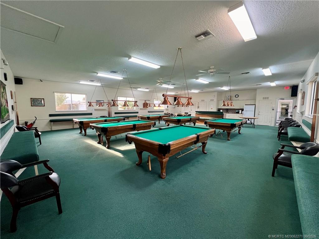10701 South Ocean Drive, Unit 713 Jensen Beach, FL 34957 - Photo 37 of 39 a room with lots of furniture and a pool table