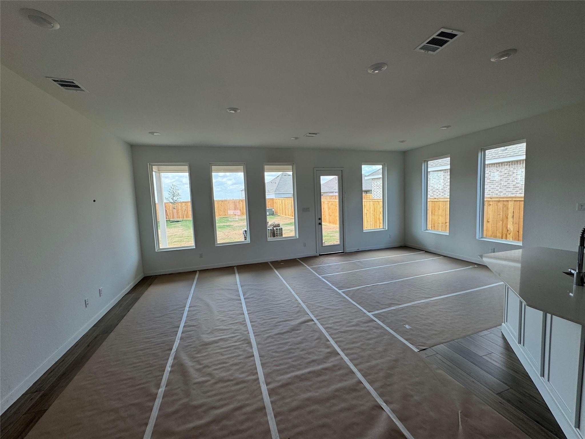 8222 Holly Blue Drive Rosharon, TX 77583 - Photo 23 of 23 a view of an empty room with a fireplace and windows
