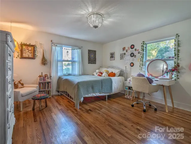 a bedroom with bed and a window