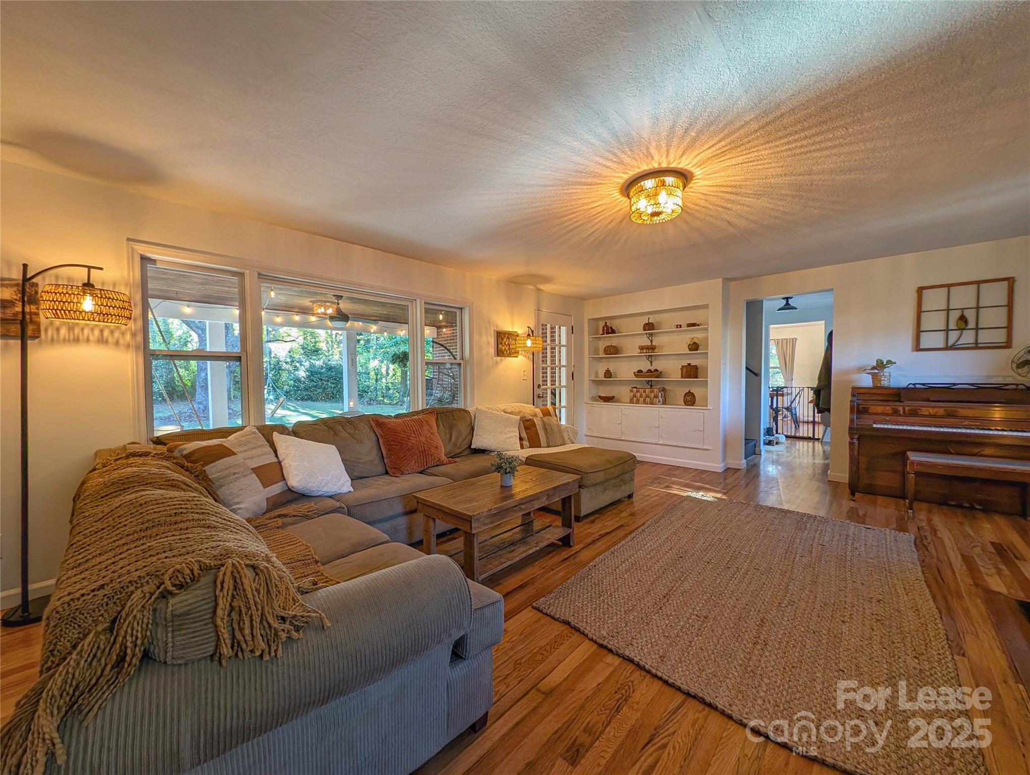 317 Balsam Drive Waynesville, NC 28786 - Photo 24 of 45 a living room with furniture and a table