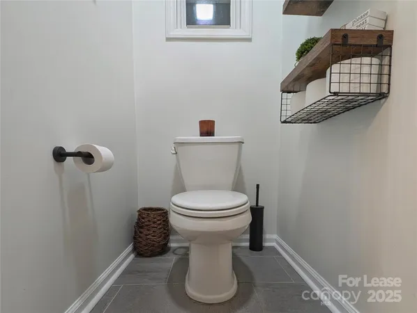 a bathroom with a toilet and a sink