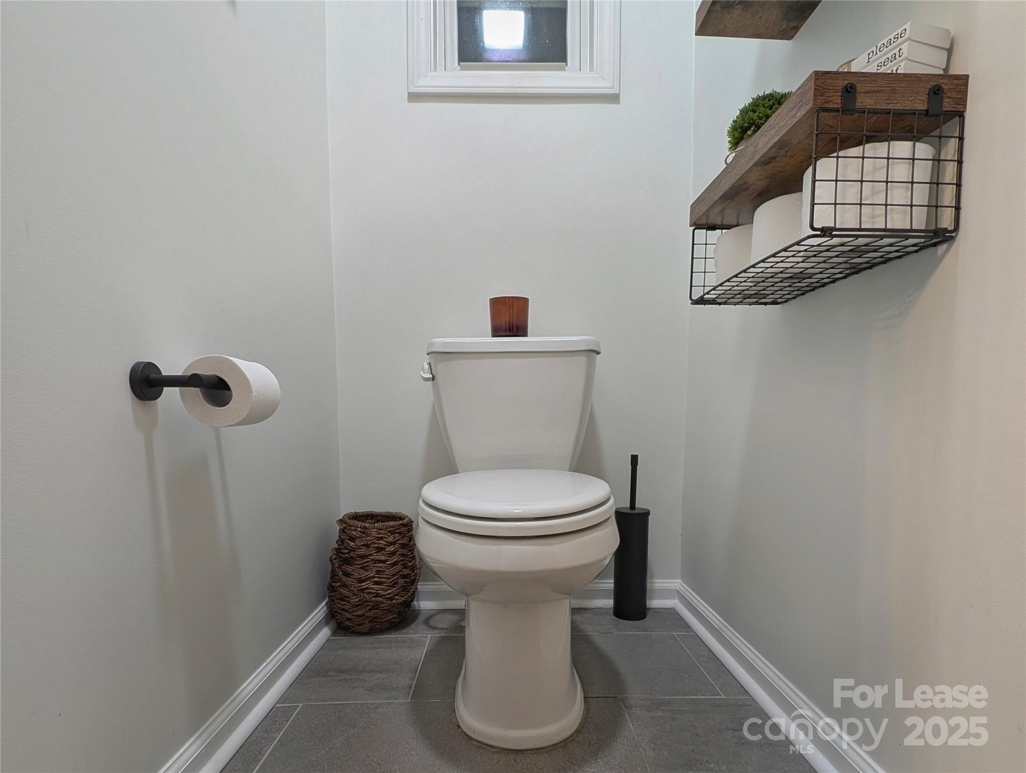 317 Balsam Drive Waynesville, NC 28786 - Photo 29 of 45 a bathroom with a toilet and a sink