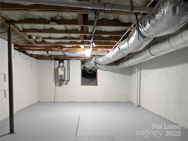 a utility room with a wooden floor