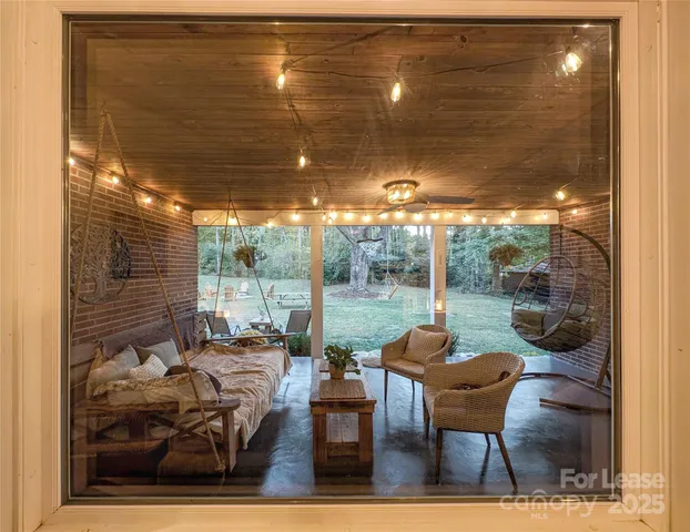 a backyard of a house with outdoor seating