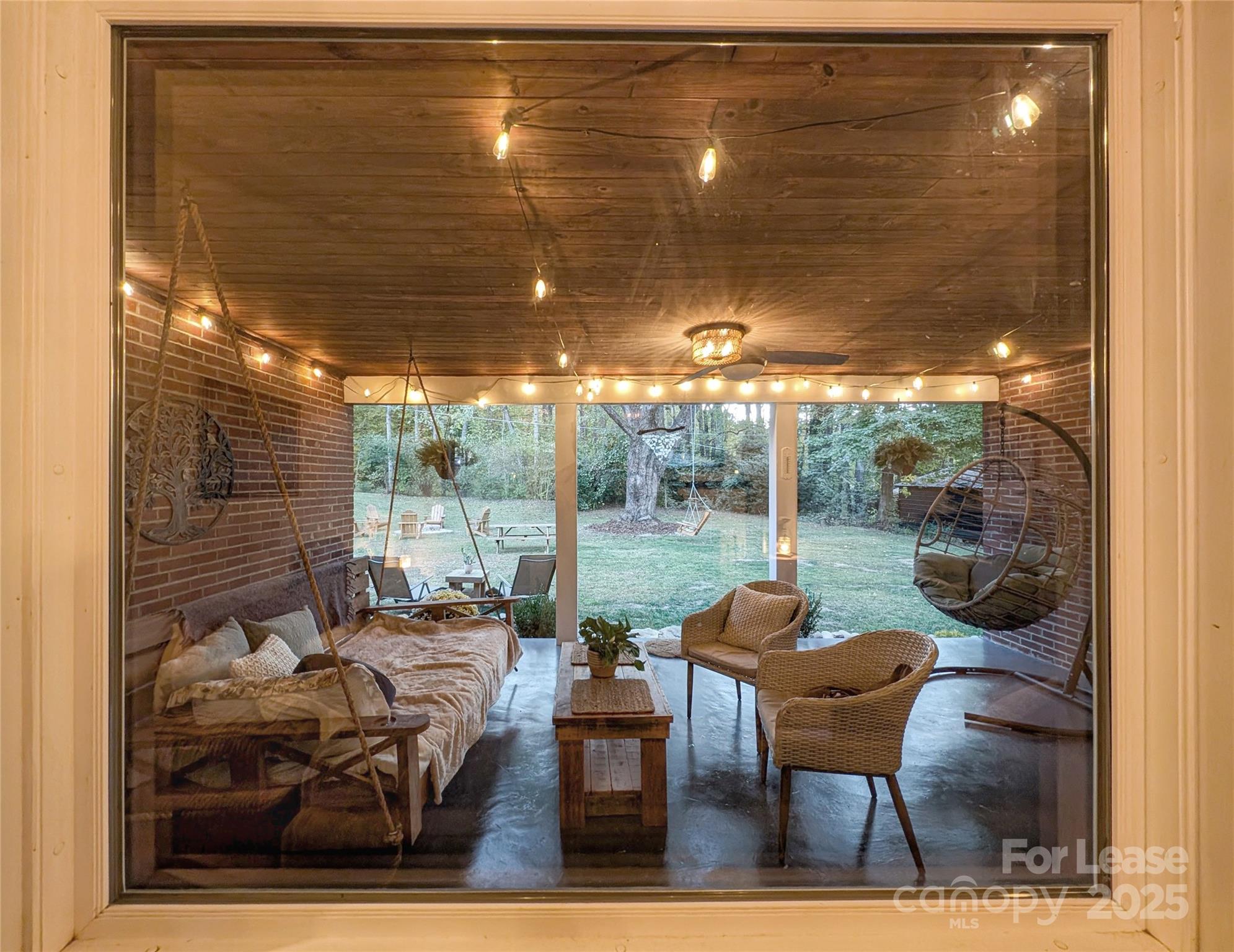 317 Balsam Drive Waynesville, NC 28786 - Photo 34 of 45 a backyard of a house with outdoor seating