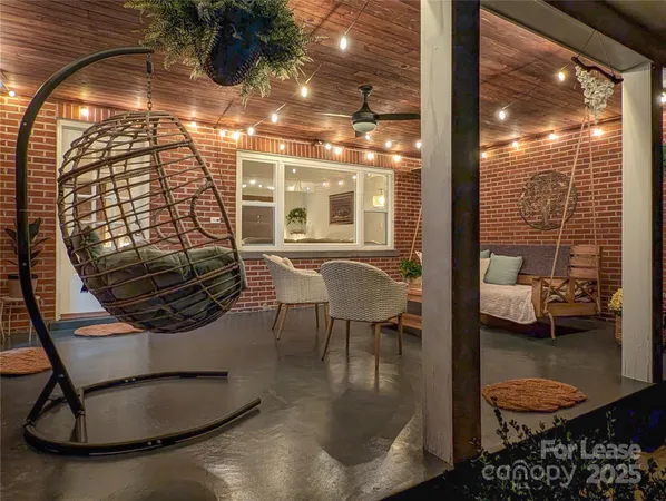 a view of swimming pool from dining room