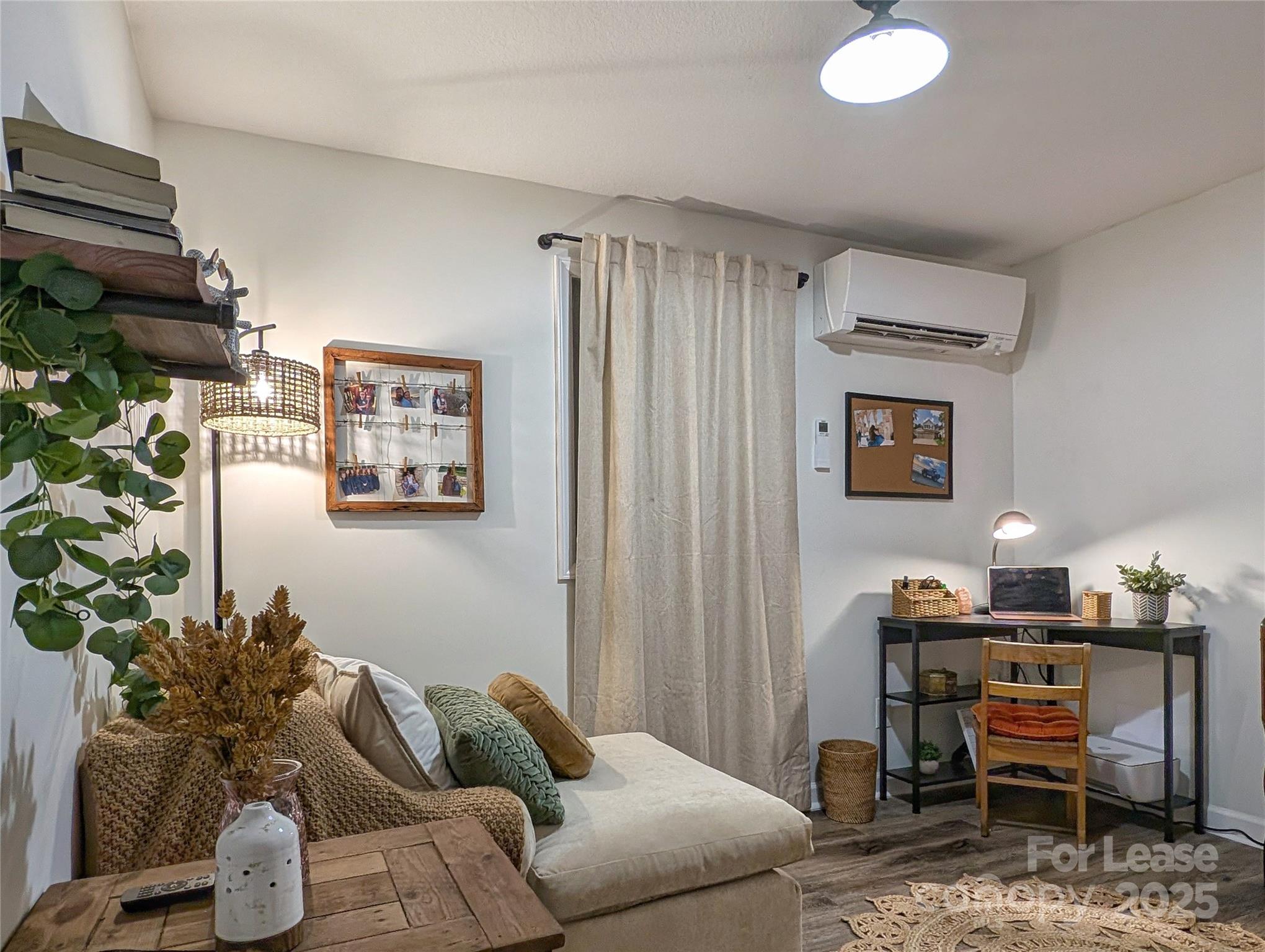 317 Balsam Drive Waynesville, NC 28786 - Photo 44 of 45 a living room with furniture and a potted plant