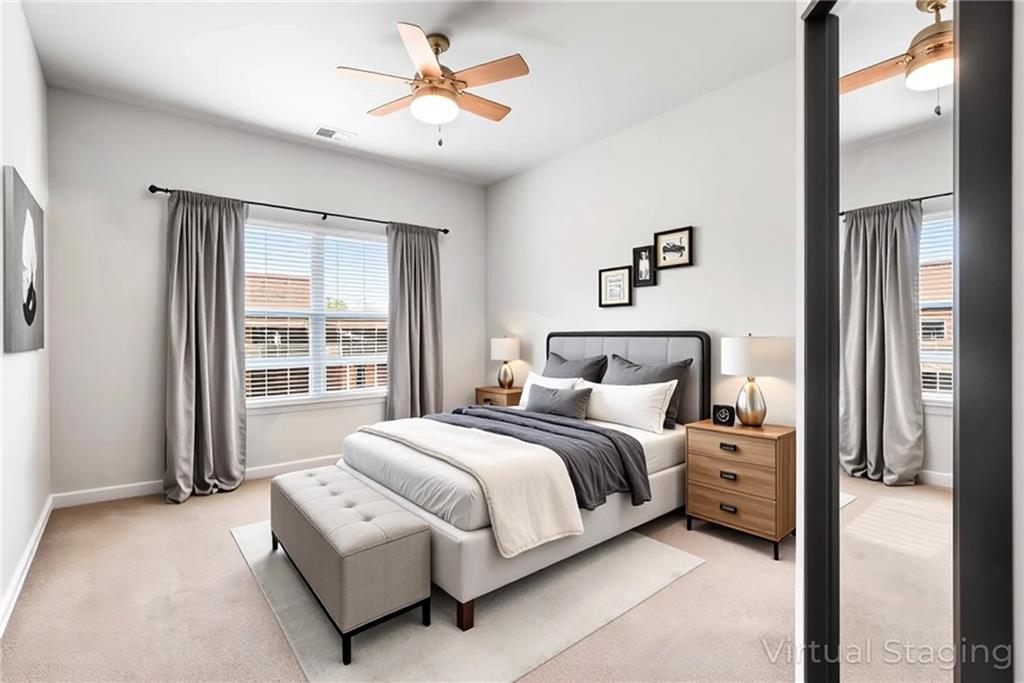 23 Carrington Way Newnan, GA 30265 - Photo 13 of 37 a bedroom with a large bed and a chandelier