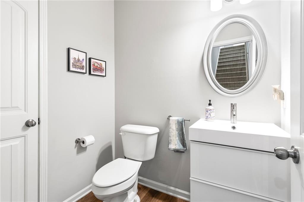 23 Carrington Way Newnan, GA 30265 - Photo 15 of 37 a bathroom with a toilet a sink and mirror