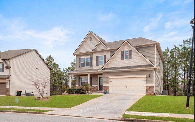 23 Carrington Way Newnan, GA 30265 - Photo 2 of 37 a front view of a house with a yard