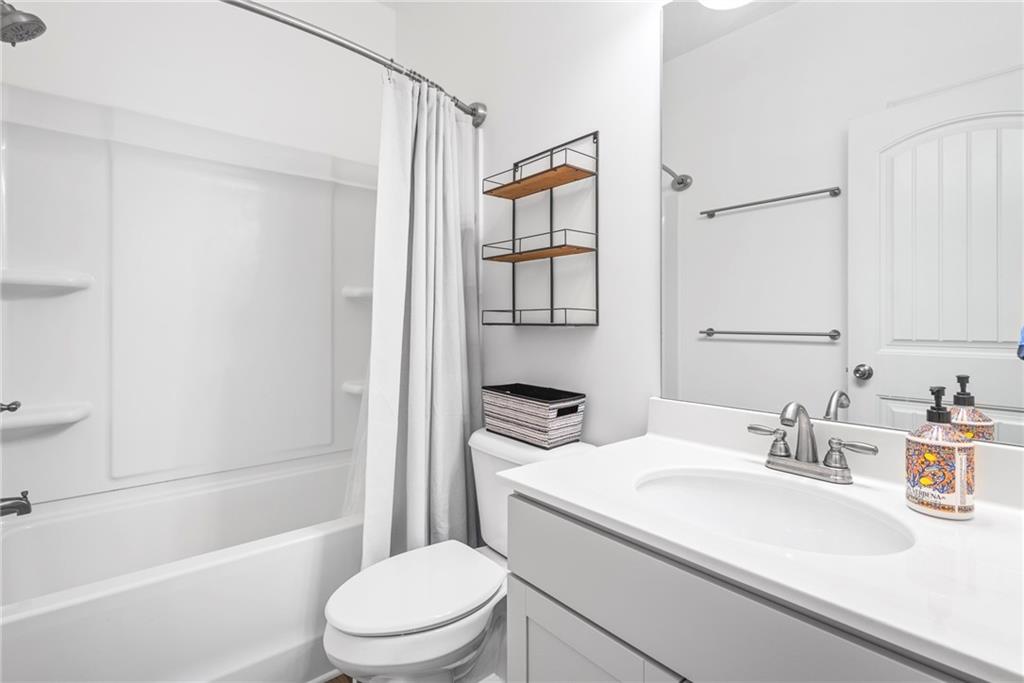 23 Carrington Way Newnan, GA 30265 - Photo 25 of 37 a bathroom with a sink a toilet and shower