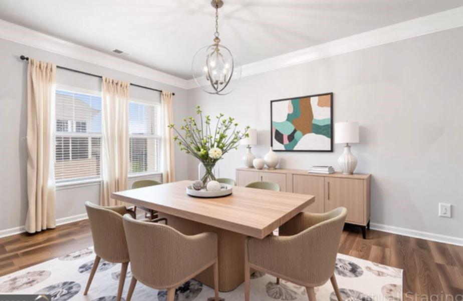 23 Carrington Way Newnan, GA 30265 - Photo 6 of 37 a dining room with furniture wooden floor and a chandelier
