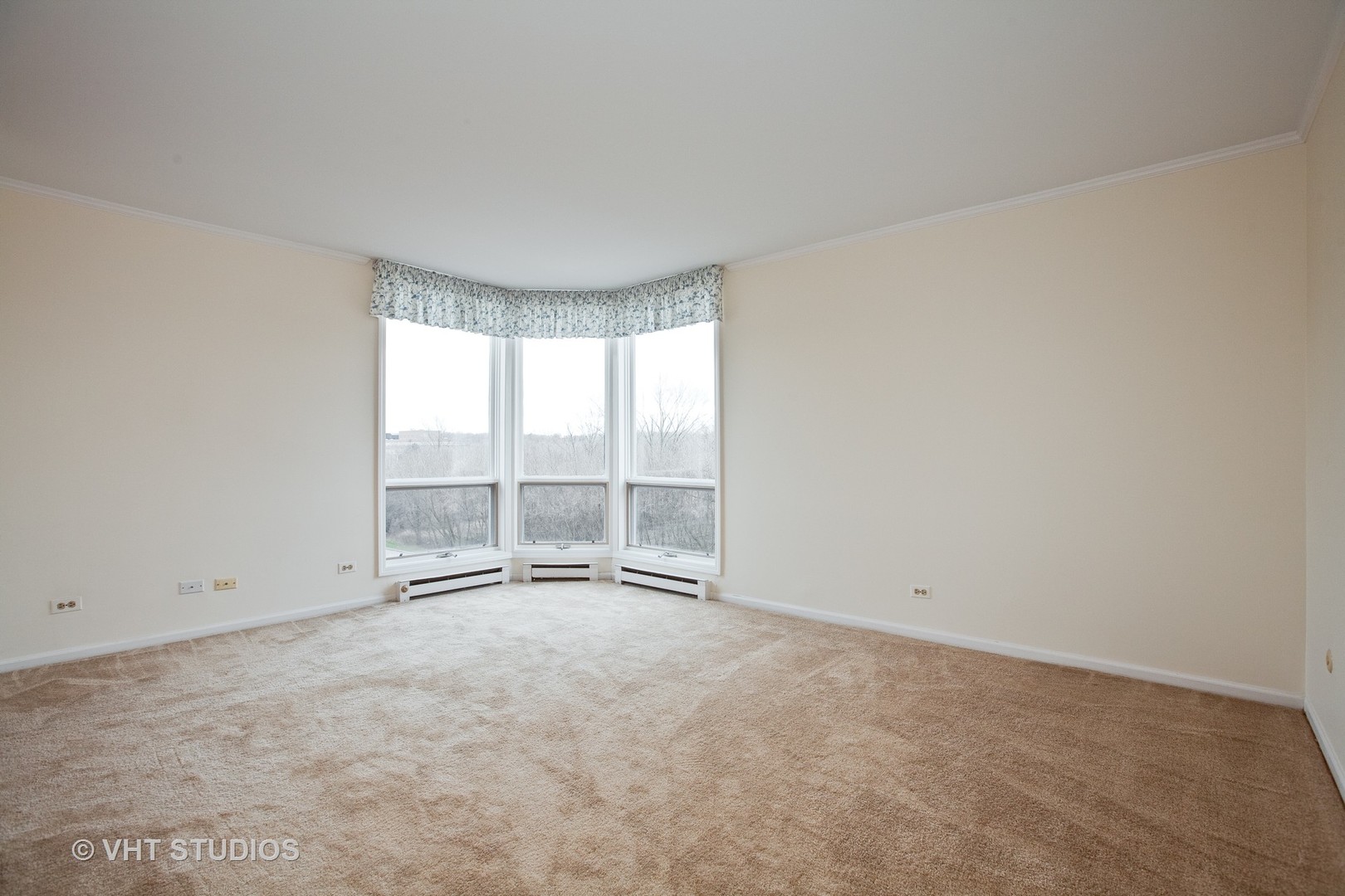 1140 Old Mill Road, Unit 408F Hinsdale, IL 60521 - Photo 7 of 11 a view of an empty room with a window