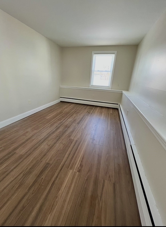 10 Edgemere Road Quincy, MA 02169 - Photo 13 of 25 wooden floor in an empty room and window