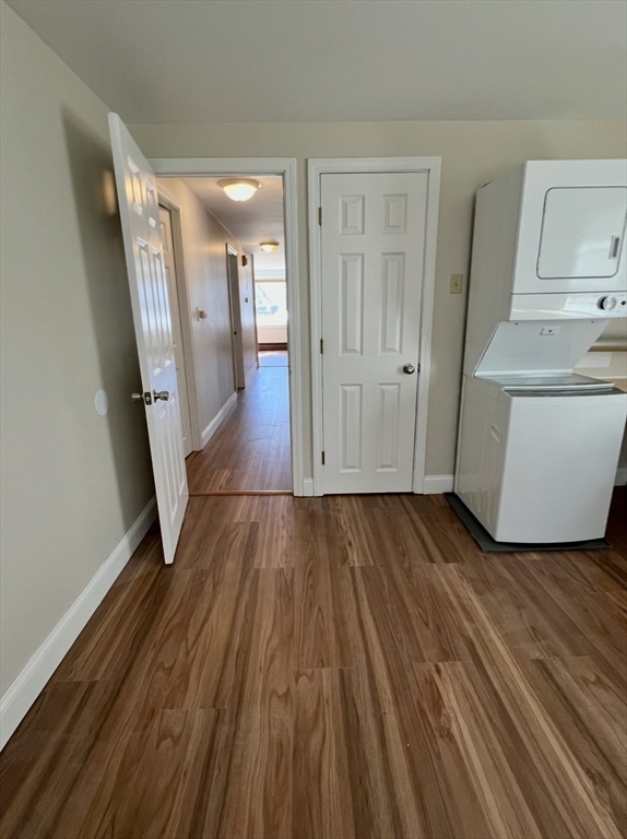 10 Edgemere Road Quincy, MA 02169 - Photo 17 of 25 a view of a hallway with wooden floor and stairs