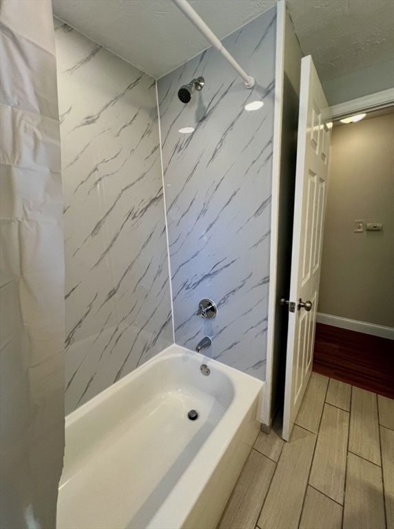 10 Edgemere Road Quincy, MA 02169 - Photo 21 of 25 a bathroom with a bathtub and shower