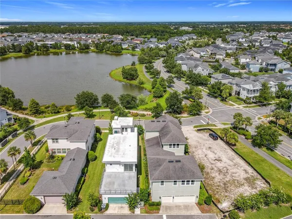 an aerial view of a city with lake view