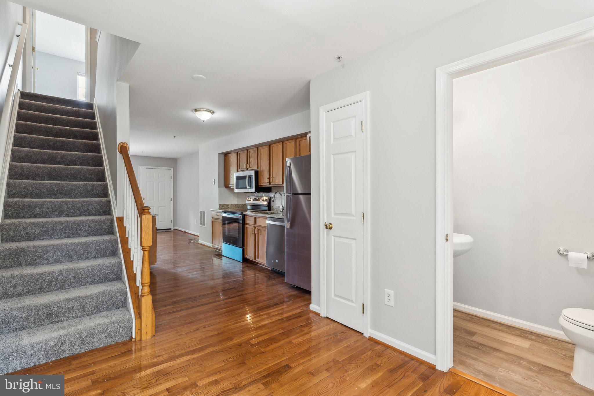 28 Johnson Place Annapolis, MD 21401 - Photo 19 of 35 a view of a hallway with wooden floor and entryway