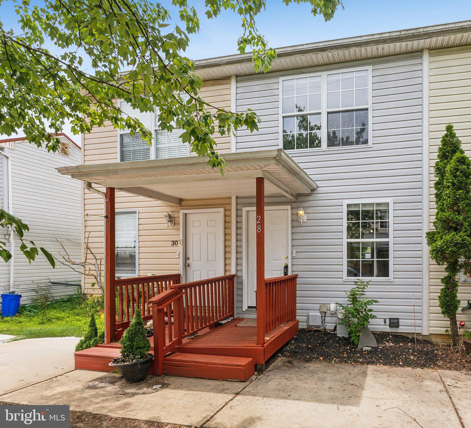 28 Johnson Place Annapolis, MD 21401 - Photo 2 of 35 a view of a deck with couches and wooden fence next to a yard