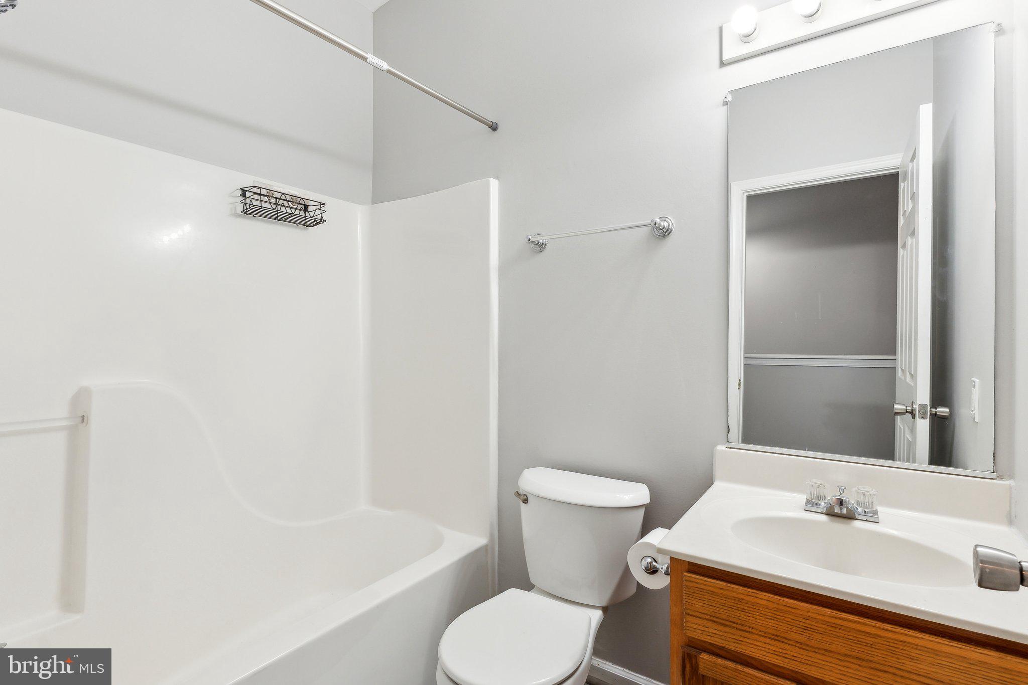 28 Johnson Place Annapolis, MD 21401 - Photo 23 of 35 a bathroom with a sink toilet and shower