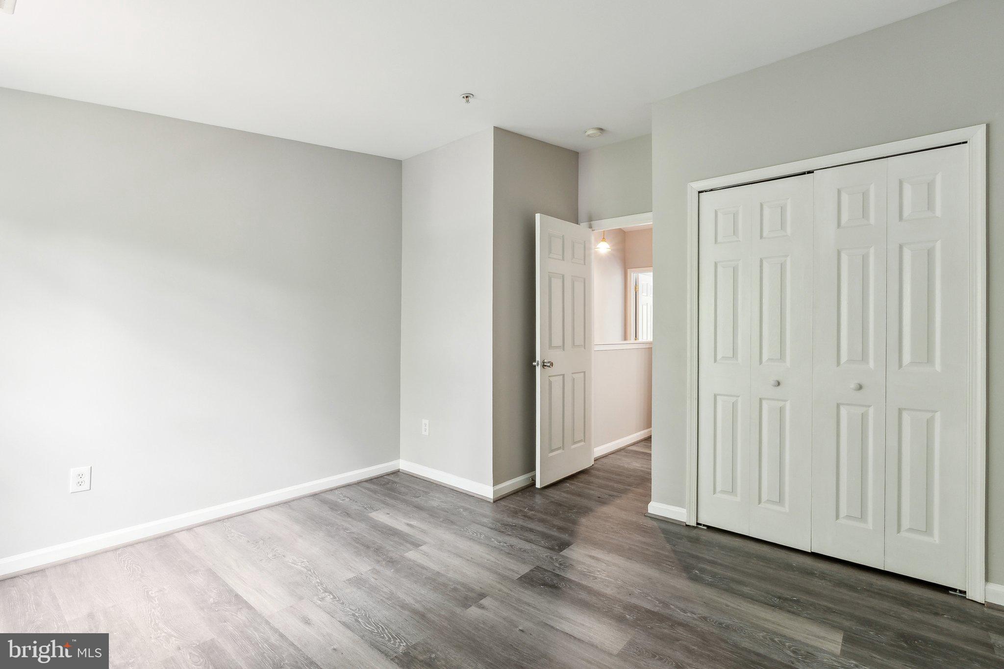 28 Johnson Place Annapolis, MD 21401 - Photo 10 of 35 a view of an empty room with wooden floor