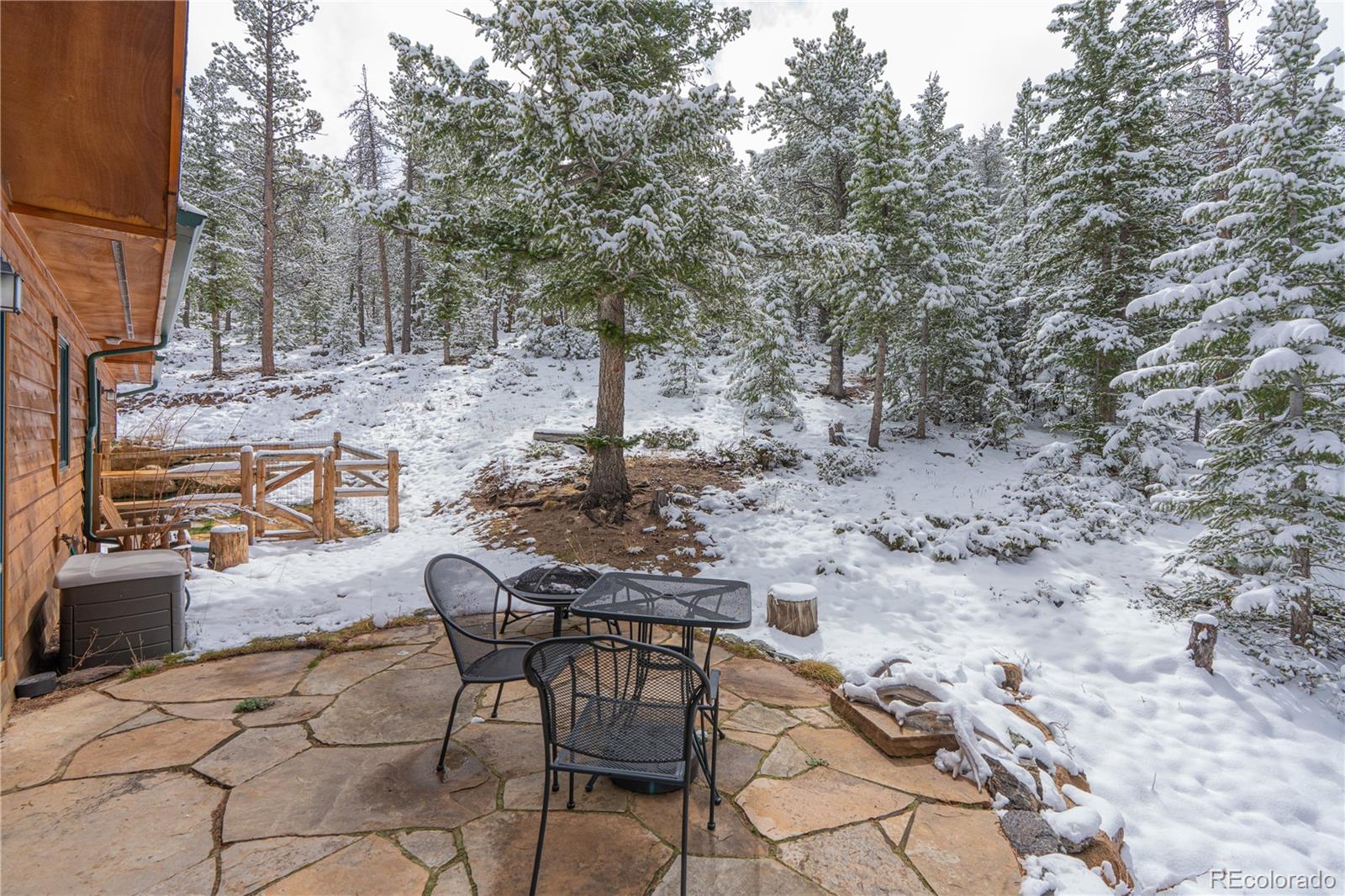 2147 McGraw Ranch Road Estes Park, CO 80517 - Photo 11 of 26 a view of backyard with table and chairs and couches