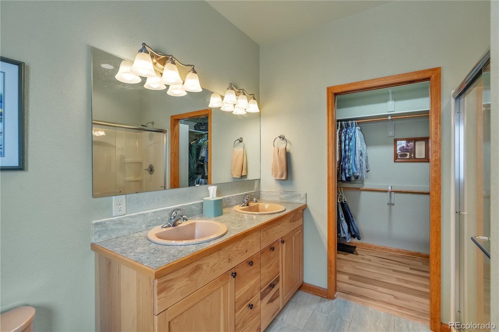 2147 McGraw Ranch Road Estes Park, CO 80517 - Photo 17 of 26 a bathroom with a sink a light fixture and a mirror