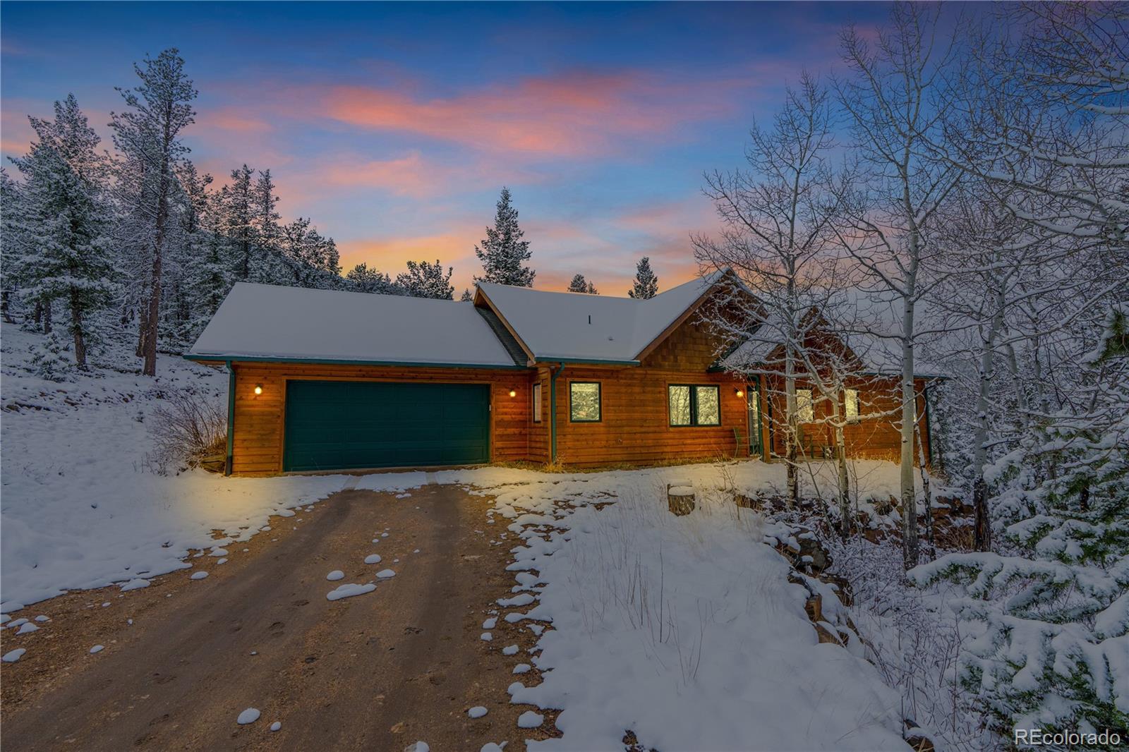2147 McGraw Ranch Road Estes Park, CO 80517 - Photo 2 of 26 a front view of a house with a yard