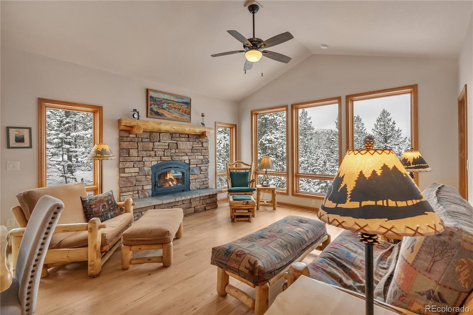 2147 McGraw Ranch Road Estes Park, CO 80517 - Photo 7 of 26 a living room with furniture fireplace and a large window