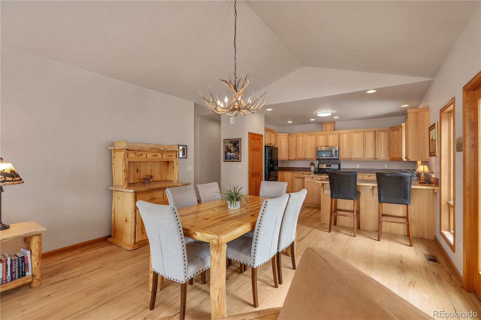 2147 McGraw Ranch Road Estes Park, CO 80517 - Photo 9 of 26 a view of a dining room with furniture and wooden floor