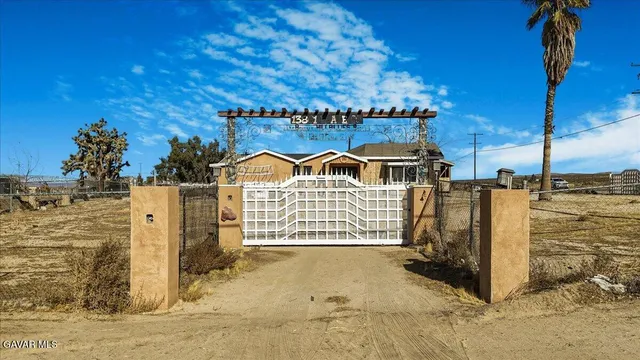 a view of a balcony with wooden fence