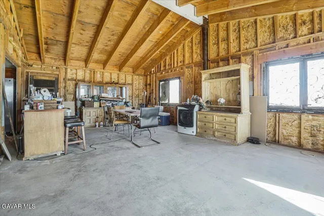 a kitchen with stainless steel appliances granite countertop a stove sink and cabinets