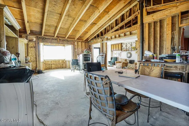 a living room with furniture and a clock