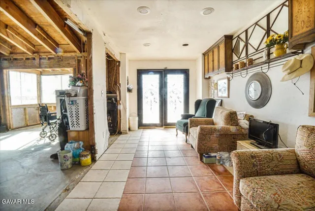 a view of hall way with furniture