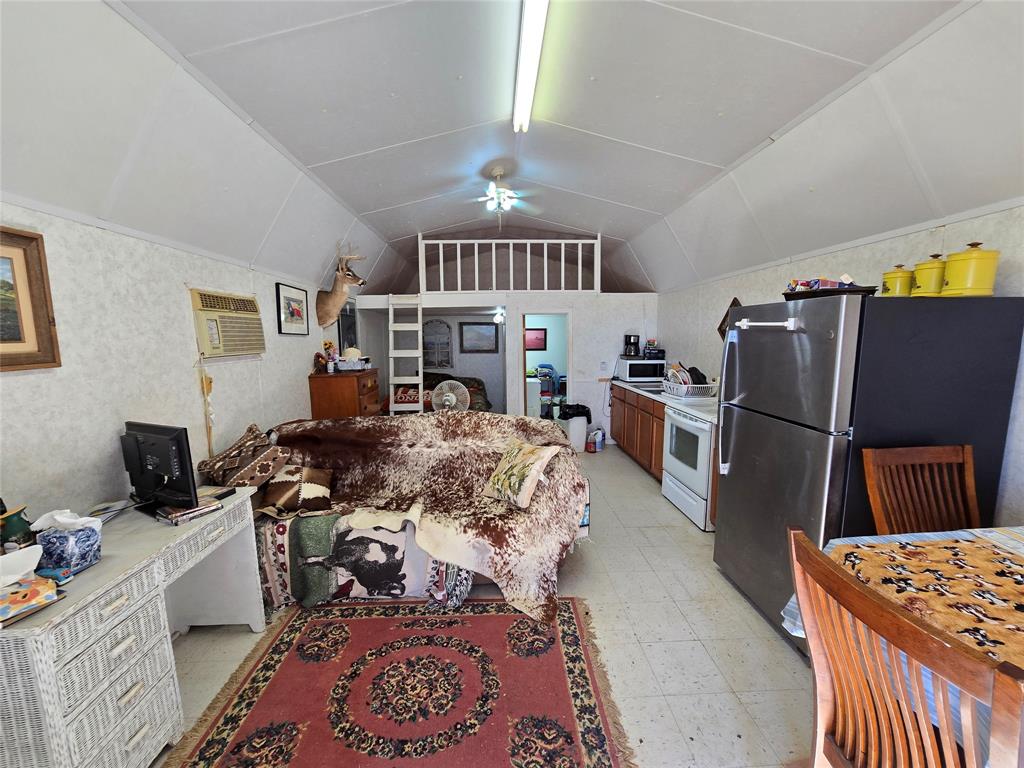 5780 County Road 266 Rochelle, TX 76872 - Photo 11 of 40 a very nice looking room with a large bed a flat tv screen and a dresser